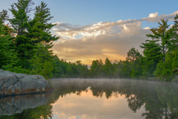 istock Sunrise over reflection in lake 2152727560