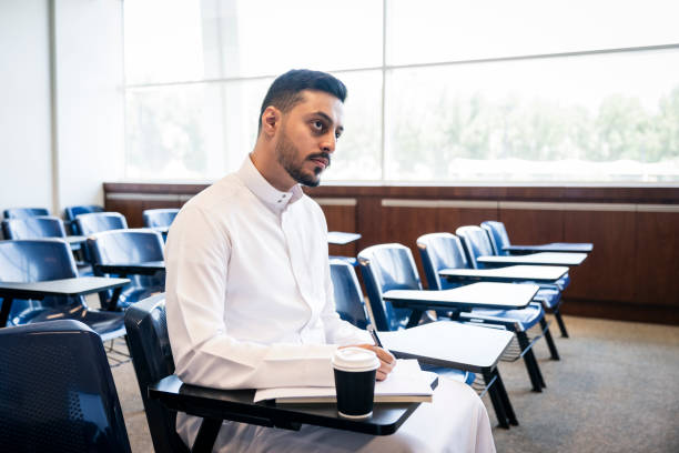 istock Candid portrait of male university student taking notes 2152729206