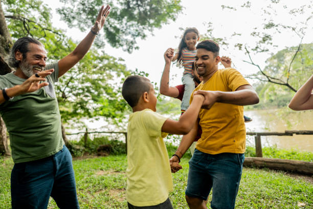 istock Step-father having fun during piggyback with adopted kids on a public park 2152730872