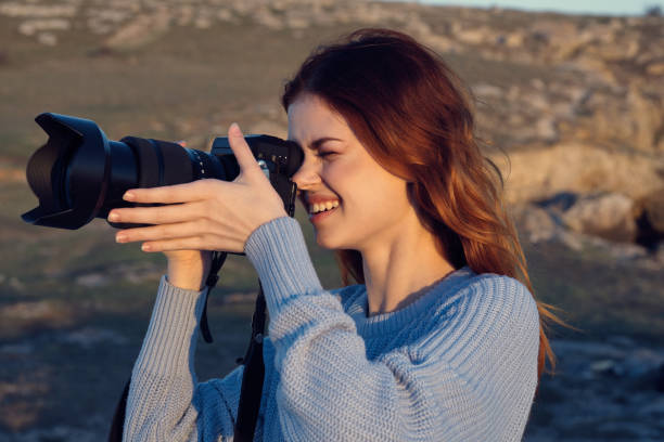 istock woman professional photographer outdoors hobby work landscape 2152731409