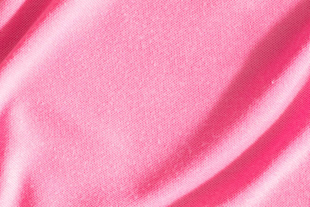 Pink canvas fabric background with copy space for design.