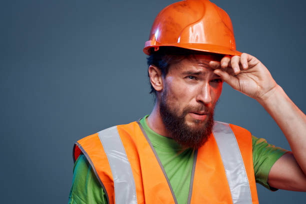 istock Angry man in work uniform orange paint safety hard work cropped view 2152732374