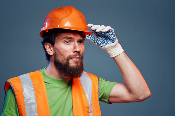 istock A man in orange paint. Hard work of a builder 2152733064