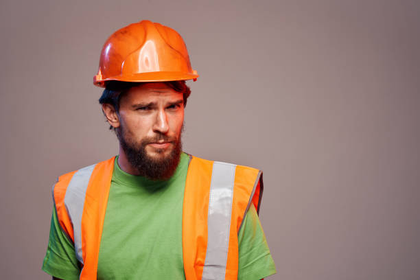 istock Man in working uniform orange paint safety work cropped view 2152733481