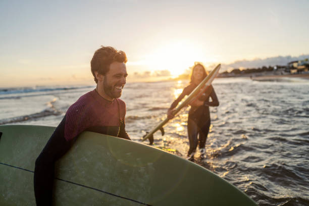 The excited surfers preparing for action.