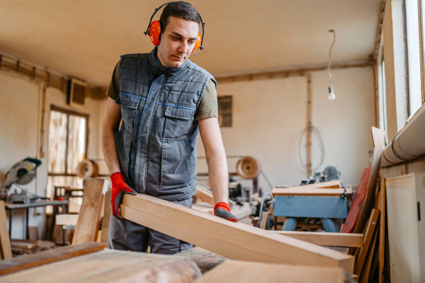 istock Young Male Carpenter Working With Wood In His Workshop 2152733945