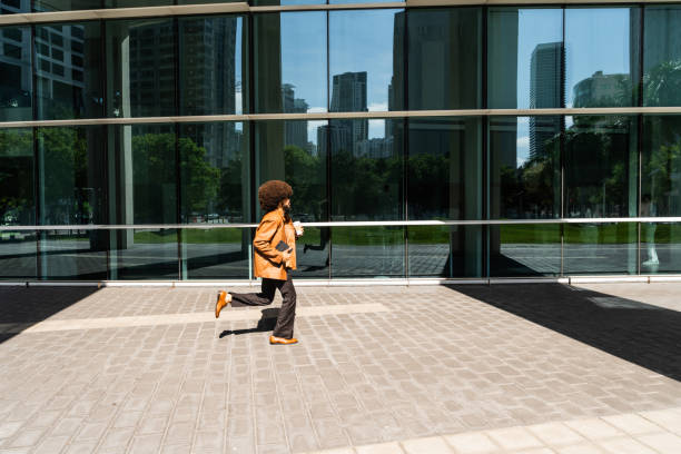 istock Young businessman running on the city 2152734429