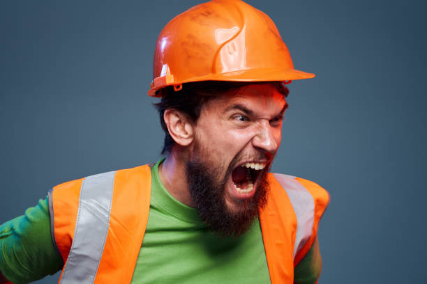 istock emotional man worker orange paint hard work 2152735243