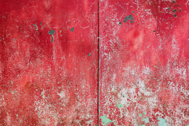 istock Red metal surface with rust spots and peeled and textured paint. 2152740580