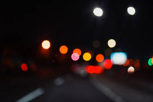istock Blur photo. Vehicle headlight camera bokeh 2152741565