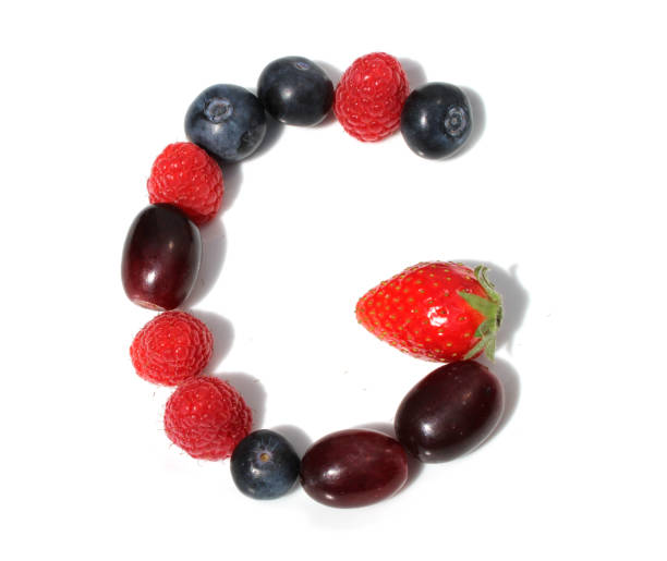 istock letter G made from raspberry, strawberries, blueberries, grape. isolated berries letter for party 2152745155
