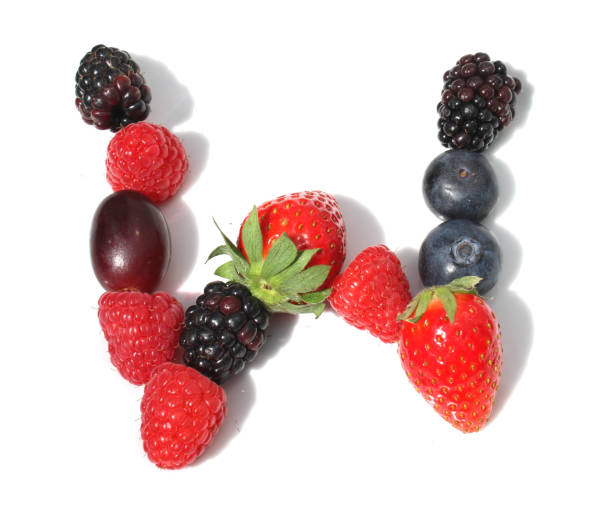 istock letter W made from raspberry, strawberries with green leaf, blueberries, blackberry, grape. isolated berries letter for party berry waffle 2152745254