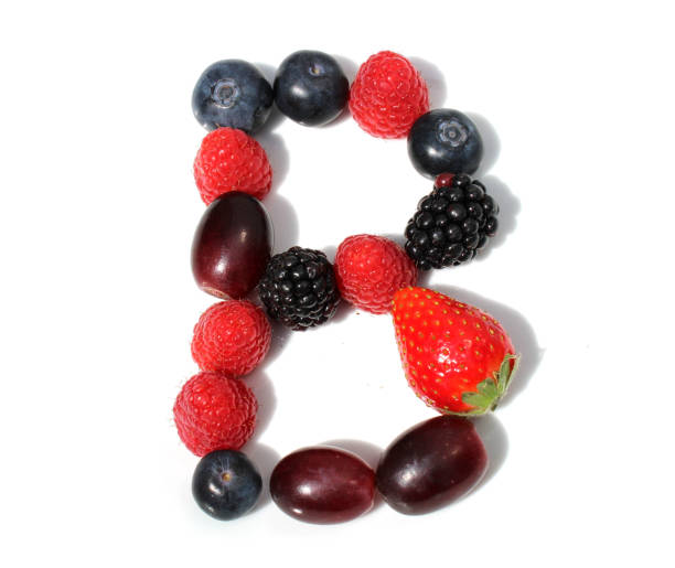 istock letter B made from raspberry, strawberries, blueberries, grape. isolated berries letters for birthday party 2152745328