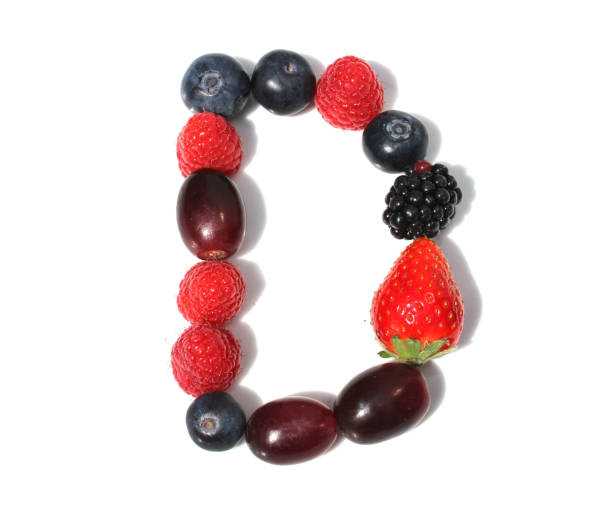 istock letter D made from raspberry, strawberries, blueberries, grape. isolated berries letter for party invitation card 2152745338