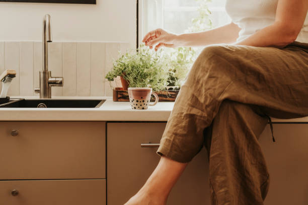 istock Woman at home indoors in her kitchen drinking coffee 2152745570