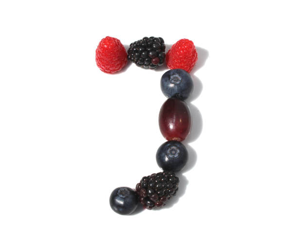 istock letter J made from raspberry, blackberries blueberries, grape. isolated berries letters for party, juice recipe 2152745628