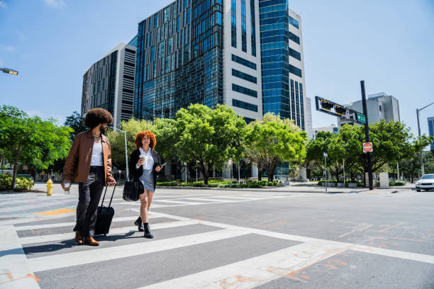 istock Young coworkers talking and walking through the city 2152746193