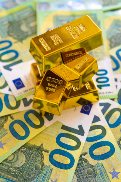 istock Gold Bars on Euro Bills: Diversifying Investments. This image features stacked gold bars on Euro bills, symbolizing the diversification of investments and the value of stable assets 2152746289