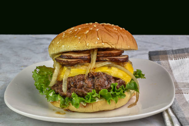 istock cheese burger with  mushrooms and onions on a sesame bun 2152746624
