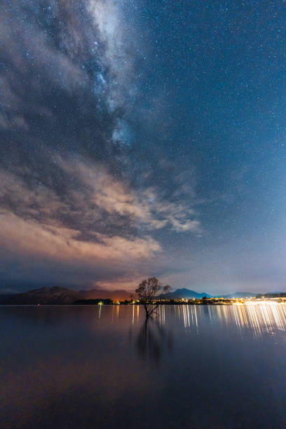 istock Milky way over Willow tree in the night at Lake Wanaka 2152747528