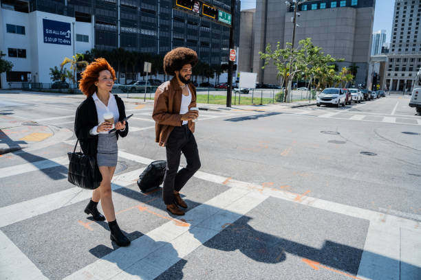 istock Young coworkers talking and walking through the city 2152747810