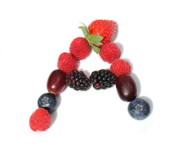 istock letter A made from raspberry, strawberries, blueberries, grape. isolated berries letters for birthday party cake or card invitation 2152748336