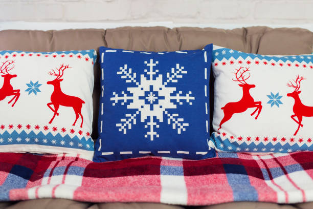 istock Three christmas pillows laying on a couch 2152748998
