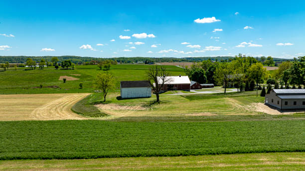 istock Serene Farmstead Amidst Varied Crop Fields 2152751247