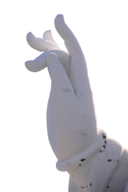 Large white cement statue of a hand isolated on white background with clipping path.
