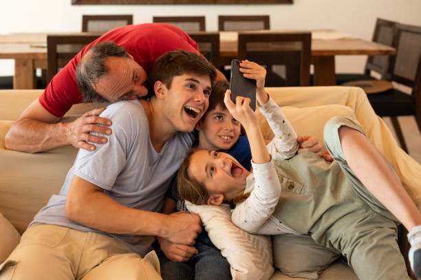 istock Hispanic American father and children taking a selfie 2152756699