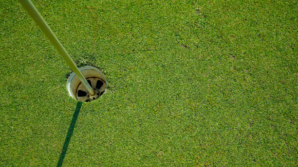istock Top view. Golf hole on a green grass 2152759380