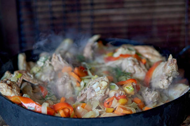 istock Pollo al disco with vegetables cooked in an old plow disk, typical argentine food. 2152759582