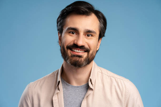 istock Smiling young man wearing casual posing isolated on blue, looking at camera 2152761732