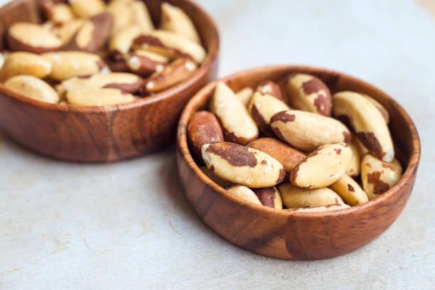 istock Brazil nut in wooden bowl 2152763603