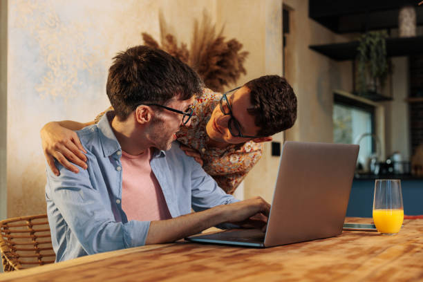 istock Romantic gay couple working remote. 2152764268