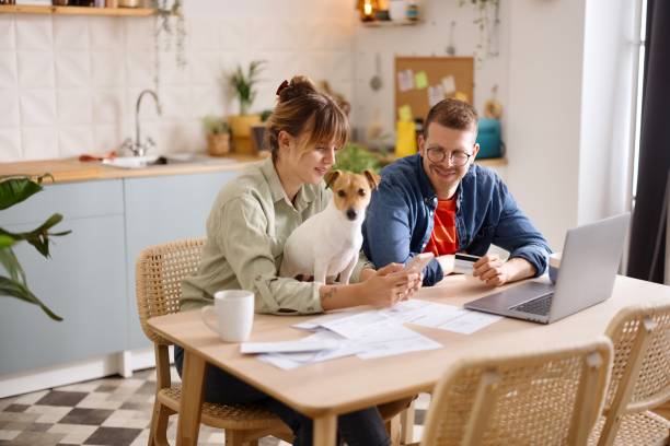 istock Young couple doing paperwork at home 2152765819