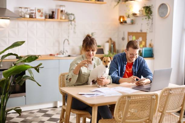 istock Joyful couple working on a computer at home 2152765820