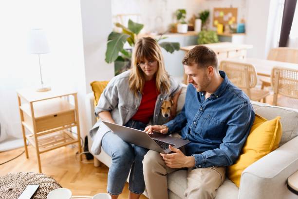 istock Beautiful couple doing online shopping 2152766367