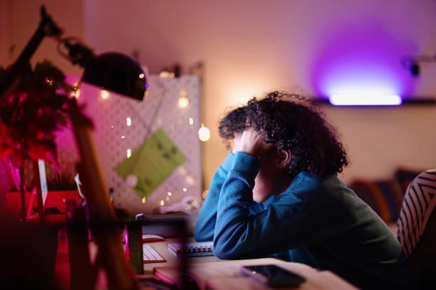 istock Tired teenager studying at home 2152767328