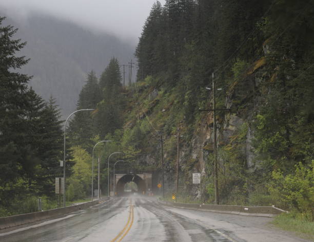 Sailor Bar Tunnel, Canada - April 28, 2024: Rainy afternoon in the Coast Mountain Range. Looking south through Sailor Bar Tunnel near the Fraser River.