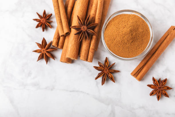 istock Cinnamon sticks and anise on a textured background. Cinnamon roll and star anise. Spicy spice for baking, desserts and drinks. Fragrant ground cinnamon.Place for text. copy space. 2152768556