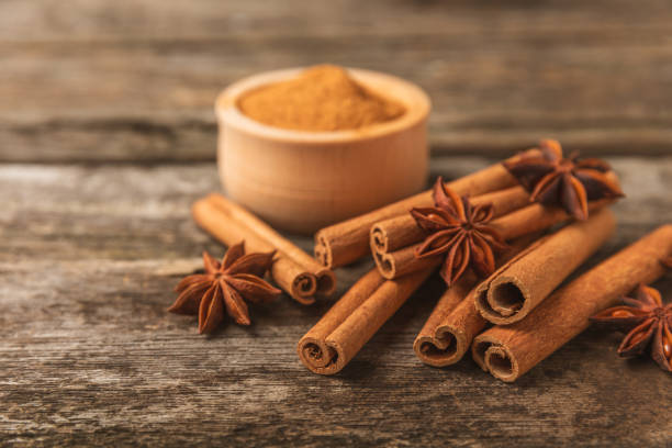 istock Cinnamon sticks and anise on a textured background. Cinnamon roll and star anise. Spicy spice for baking, desserts and drinks. Fragrant ground cinnamon.Place for text. copy space. 2152768575