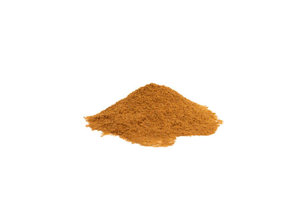 istock Cinnamon powder on background. Spicy spice for baking, desserts and drinks. Fragrant ground cinnamon. Cinnamon stick. Place for text. Copy space. 2152768701