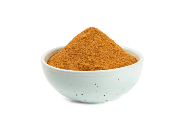 istock Cinnamon powder on background. Spicy spice for baking, desserts and drinks. Fragrant ground cinnamon. Cinnamon stick. Place for text. Copy space. 2152768716
