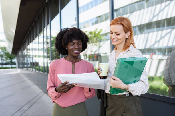 istock Two businesswomen looking at a report 2152770825