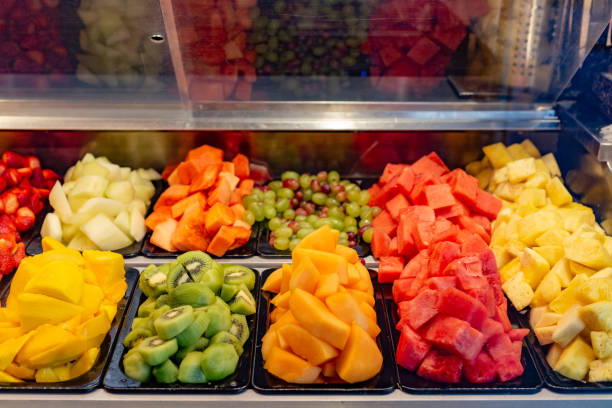 Freshly peeled ready-to-eat fruit display case at the local market store.