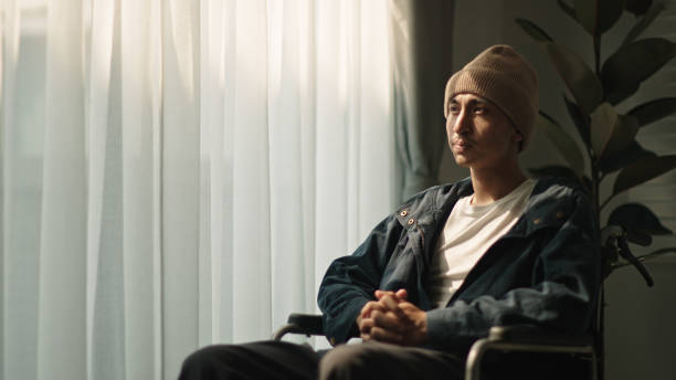 istock Man patient contemplation while sitting on wheelchair. 2152773195
