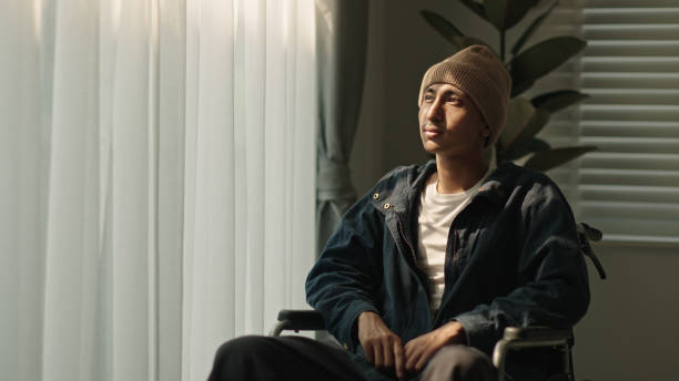 istock Man patient contemplation while sitting on wheelchair. 2152773208