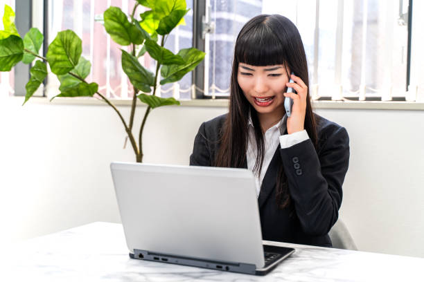 istock Female employee working on a laptop 2152773996