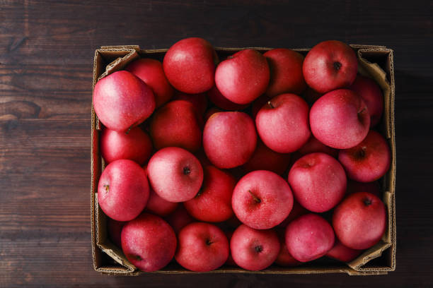 Apple fruit in wooden box isolate on white background with clipping path.